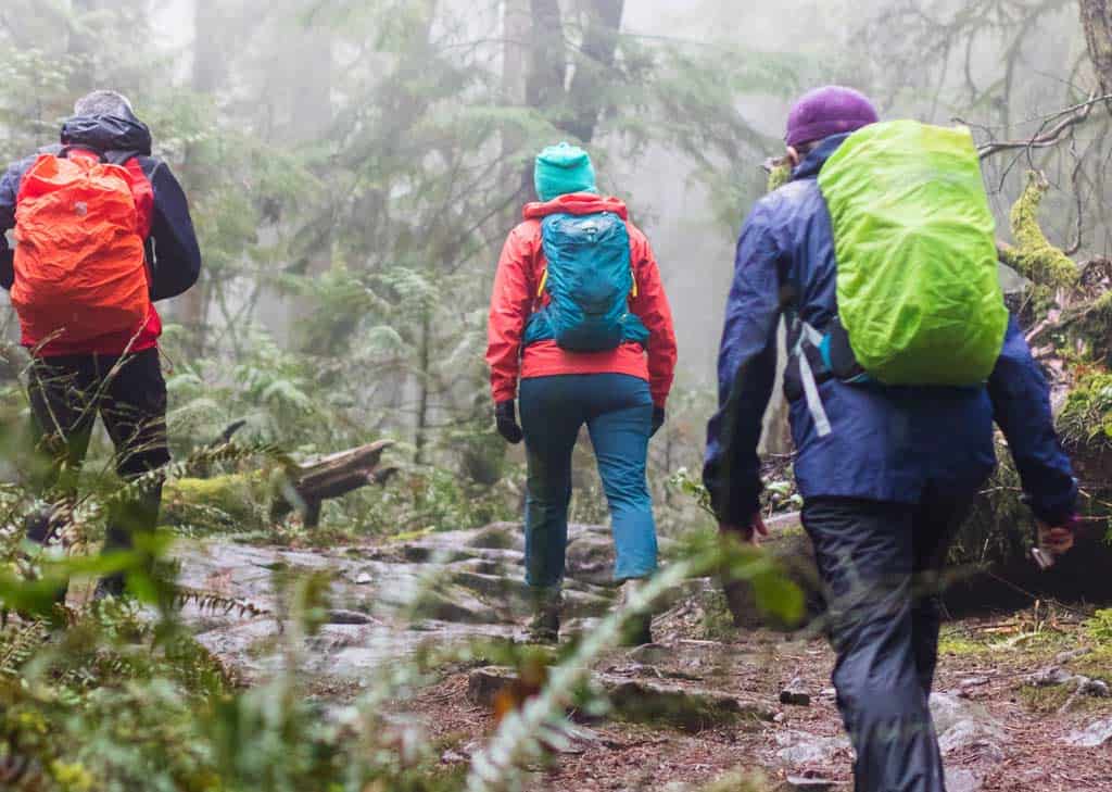 People Hiking With Rain Jeckets